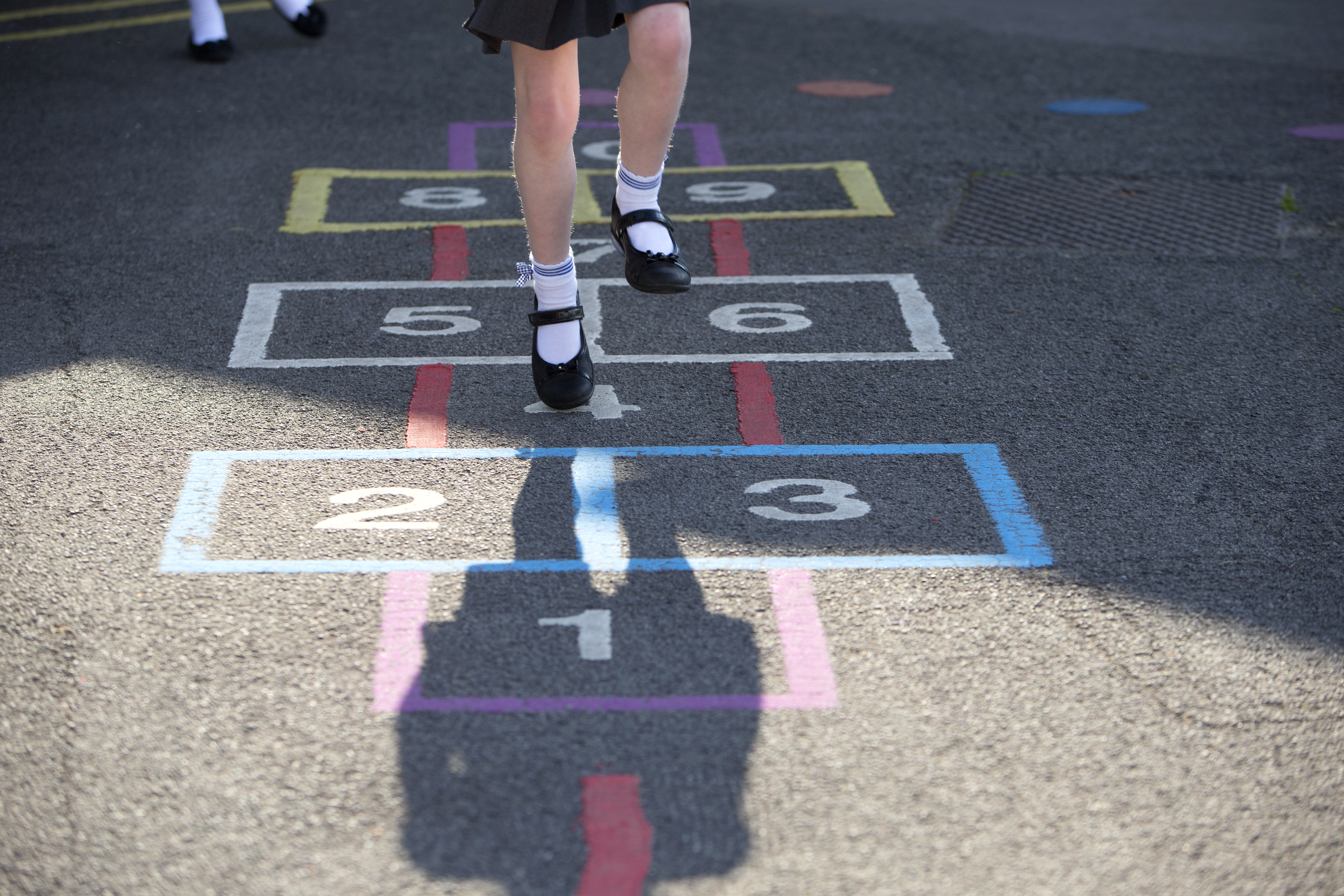 Child playing hopscotch